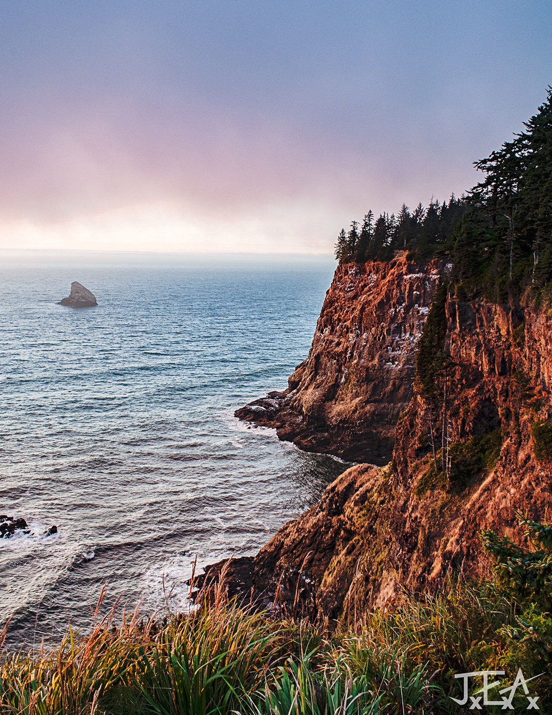 The cliffs of Cape Meares at sunset.