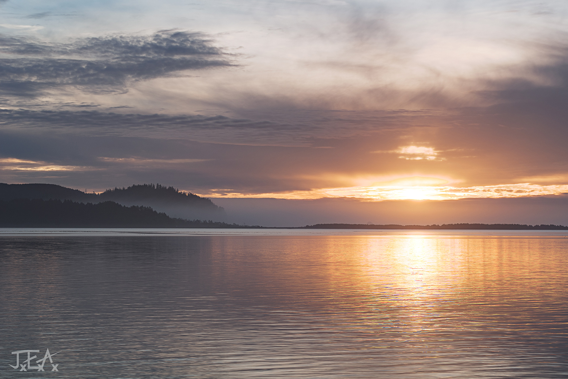 A wide shot of the Tillamook bay at sunset.